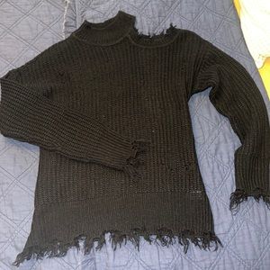 Black sweater with cut out shoulder and fringe